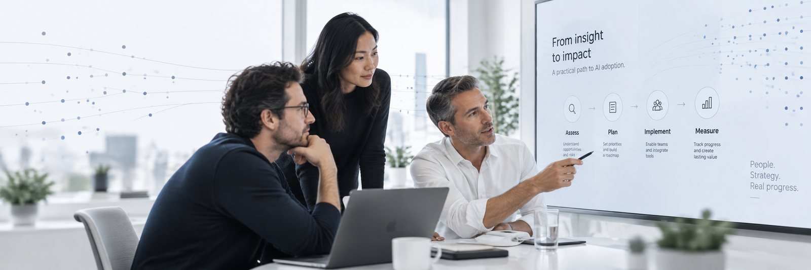 A team reviewing an AI adoption roadmap on a large display in a bright meeting room